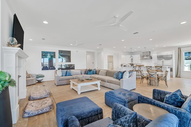134 Norwood Dr Unit Ph1, Miramar Beach, FL 32550 - living area with a ceiling fan, recessed lighting, light wood-style floors, baseboards, and ornamental molding