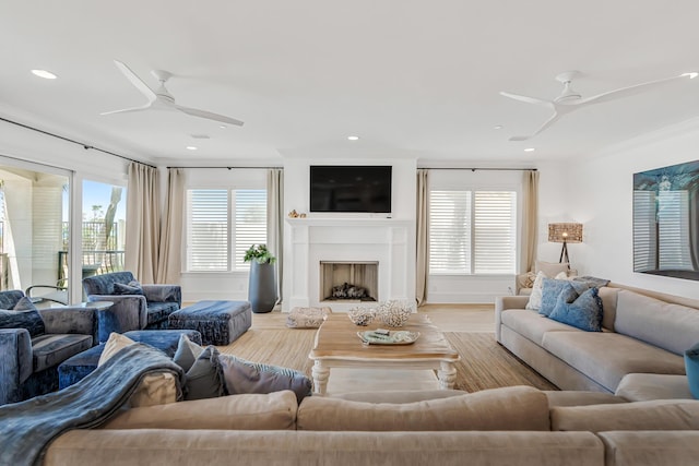 134 Norwood Dr Unit Ph1, Miramar Beach, FL 32550 - living room featuring a ceiling fan, wood finished floors, a fireplace, and recessed lighting