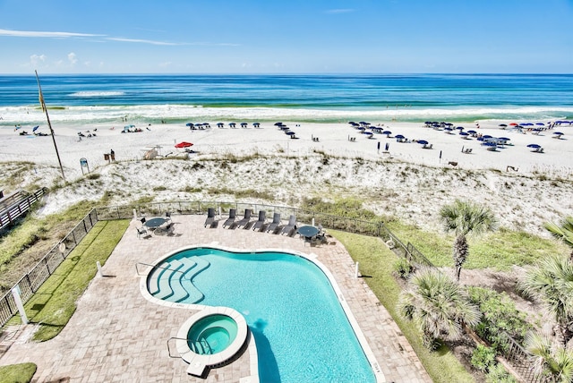 134 Norwood Dr Unit Ph1, Miramar Beach, FL 32550 - view of pool featuring view of water and beach, a patio, and a pool with connected hot tub