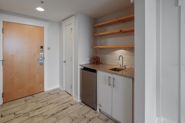 9800 Grand Sandestin Blvd Unit 5602/5604, Sandestin, FL 32550 - indoor wet bar with fridge, light wood finished floors, and baseboards