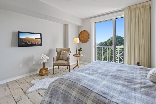 9800 Grand Sandestin Blvd Unit 5602/5604, Sandestin, FL 32550 - bedroom with wood finished floors and baseboards