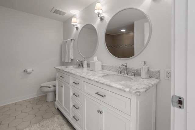 9800 Grand Sandestin Blvd Unit 5602/5604, Sandestin, FL 32550 - bathroom with double vanity, toilet, tile patterned flooring, and baseboards