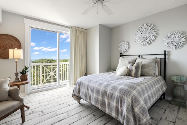 9800 Grand Sandestin Blvd Unit 5602/5604, Sandestin, FL 32550 - bedroom featuring access to outside, wood finished floors, multiple windows, and ceiling fan