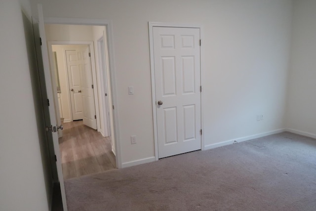 106 E Sky Way, Freeport, FL 32439 - unfurnished bedroom with baseboards and carpet