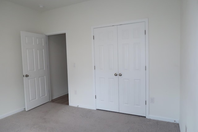 106 E Sky Way, Freeport, FL 32439 - unfurnished bedroom featuring carpet floors, a closet, and baseboards