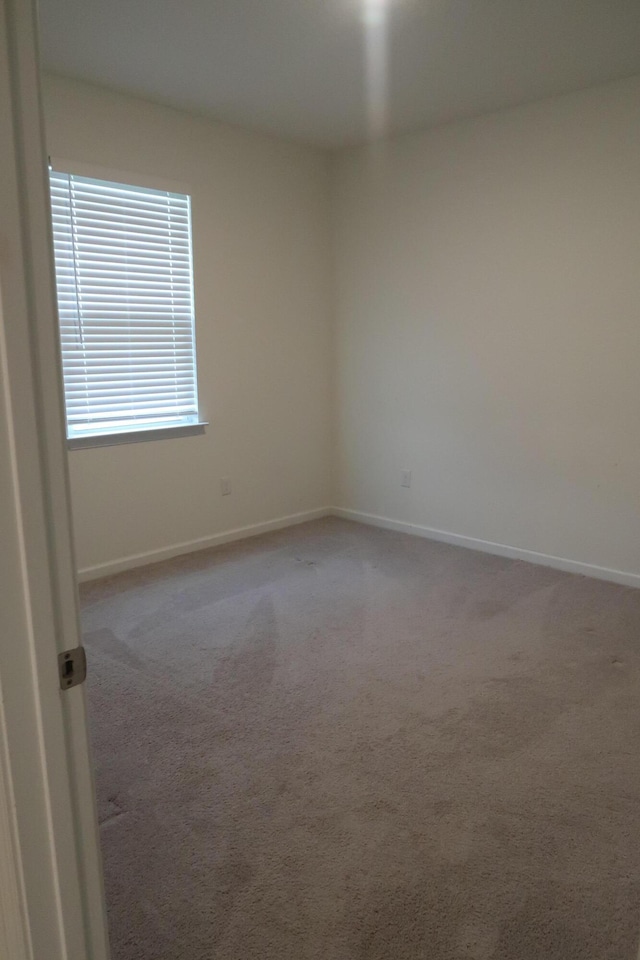 106 E Sky Way, Freeport, FL 32439 - spare room featuring carpet and baseboards