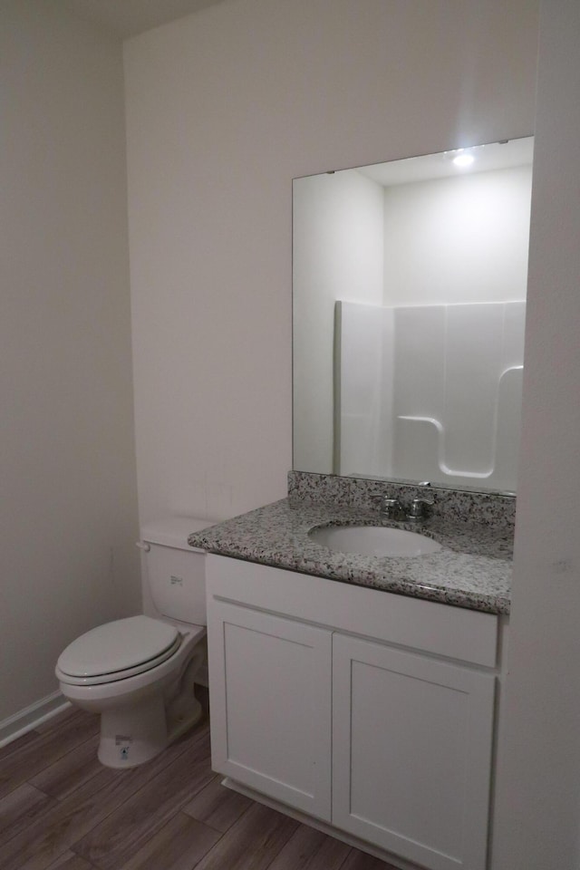 106 E Sky Way, Freeport, FL 32439 - bathroom featuring vanity, toilet, and wood finished floors
