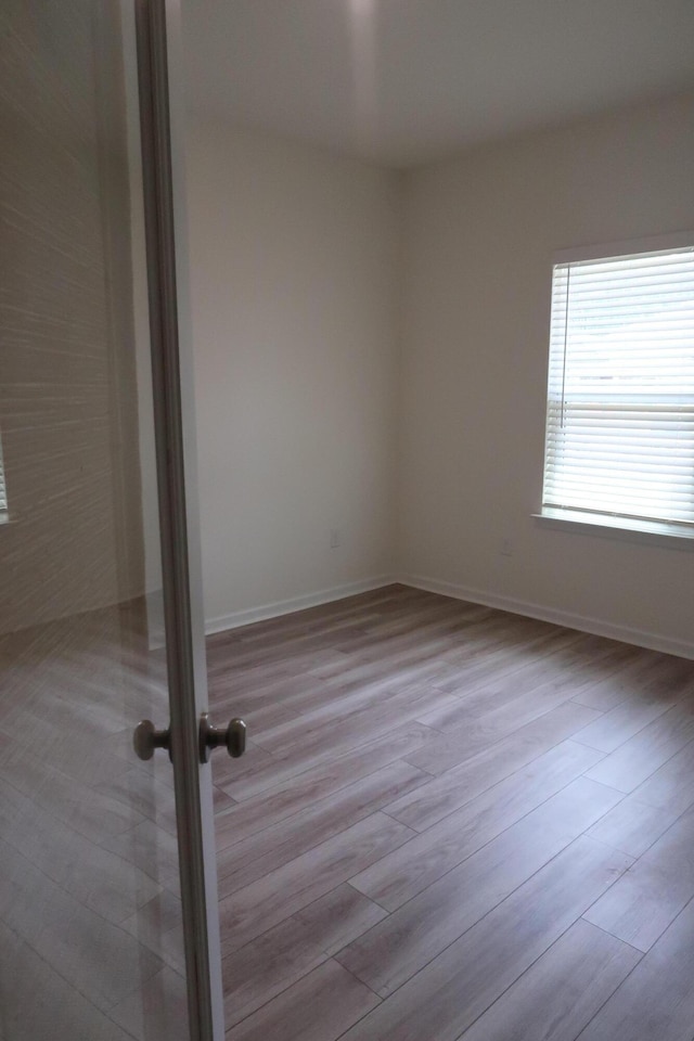 106 E Sky Way, Freeport, FL 32439 - spare room featuring wood finished floors and baseboards