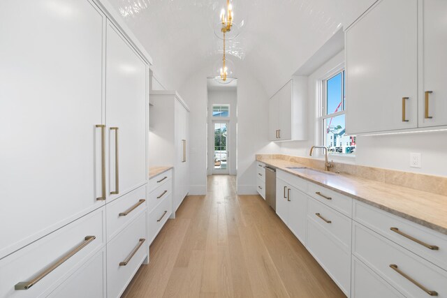 181 Climbing Rose Way, Santa Rosa Beach, FL 32459 - kitchen featuring a sink, white cabinetry, light wood-style flooring, vaulted ceiling, and open shelves