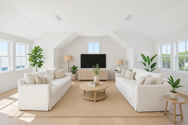 181 Climbing Rose Way, Santa Rosa Beach, FL 32459 - living room featuring lofted ceiling, baseboards, and wood finished floors