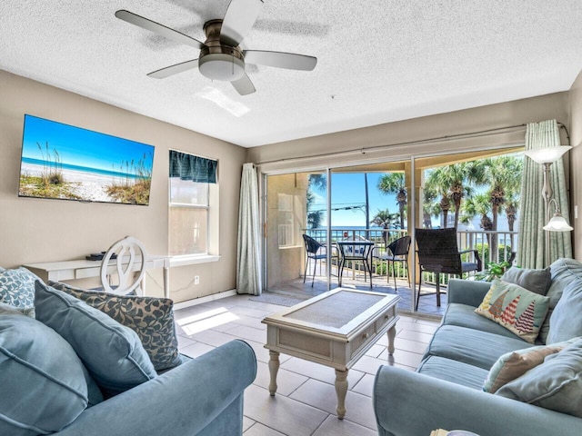 2606 Scenic Gulf Dr Unit 3208, Miramar Beach, FL 32550 - living area featuring plenty of natural light, ceiling fan, and a textured ceiling