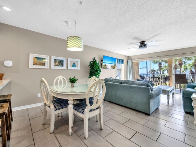 2606 Scenic Gulf Dr Unit 3208, Miramar Beach, FL 32550 - dining area featuring a textured ceiling, a ceiling fan, baseboards, and recessed lighting