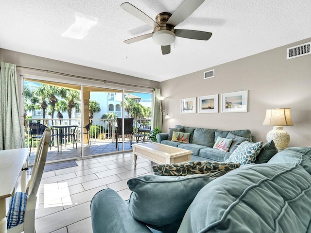 2606 Scenic Gulf Dr Unit 3208, Miramar Beach, FL 32550 - living area featuring a textured ceiling and ceiling fan