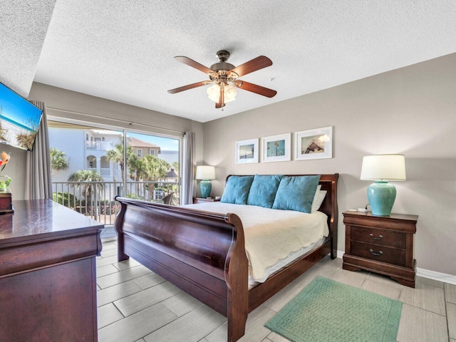 2606 Scenic Gulf Dr Unit 3208, Miramar Beach, FL 32550 - bedroom featuring access to exterior, a textured ceiling, ceiling fan, and baseboards
