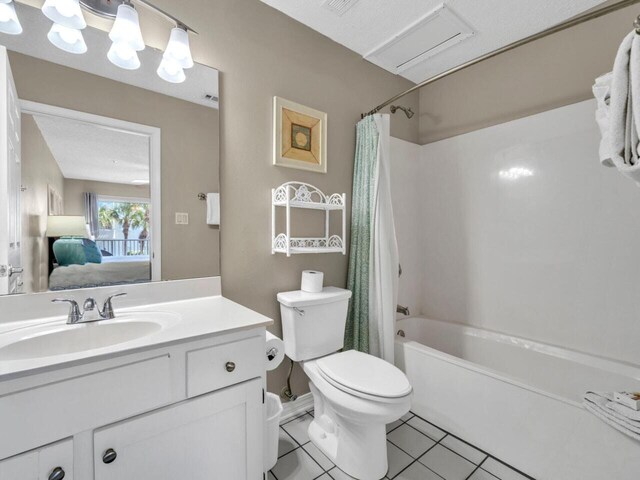 2606 Scenic Gulf Dr Unit 3208, Miramar Beach, FL 32550 - ensuite bathroom featuring shower / tub combo, vanity, toilet, and tile patterned flooring