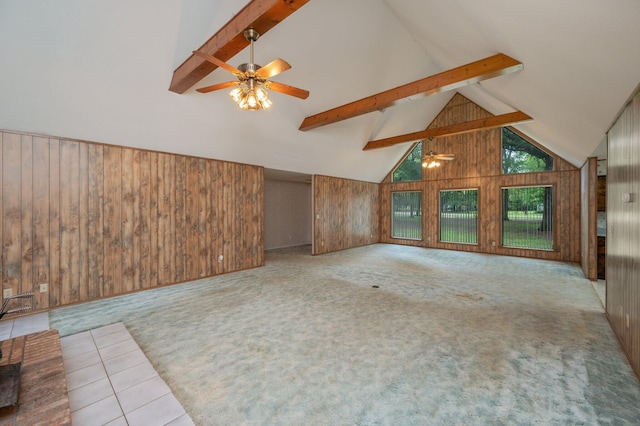 1131 Stanley Ln, Baker, FL 32531 - unfurnished living room with ceiling fan, wooden walls, beam ceiling, carpet, and high vaulted ceiling