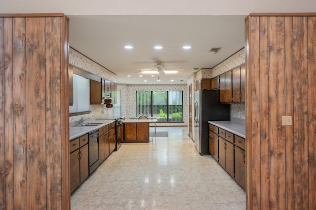 1131 Stanley Ln, Baker, FL 32531 - kitchen featuring black appliances, wallpapered walls, a ceiling fan, recessed lighting, and light countertops