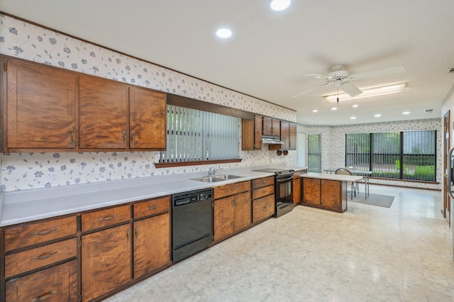 1131 Stanley Ln, Baker, FL 32531 - kitchen with black appliances, wallpapered walls, light floors, ceiling fan, and a sink
