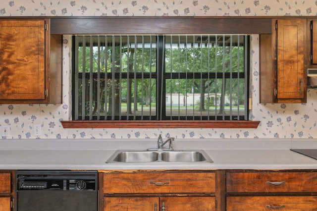 1131 Stanley Ln, Baker, FL 32531 - kitchen featuring wallpapered walls, dishwasher, a sink, light countertops, and brown cabinetry