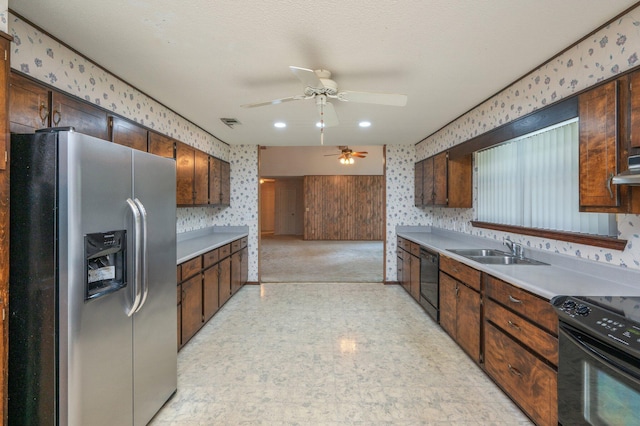 1131 Stanley Ln, Baker, FL 32531 - kitchen with black appliances, wallpapered walls, a sink, light floors, and ceiling fan
