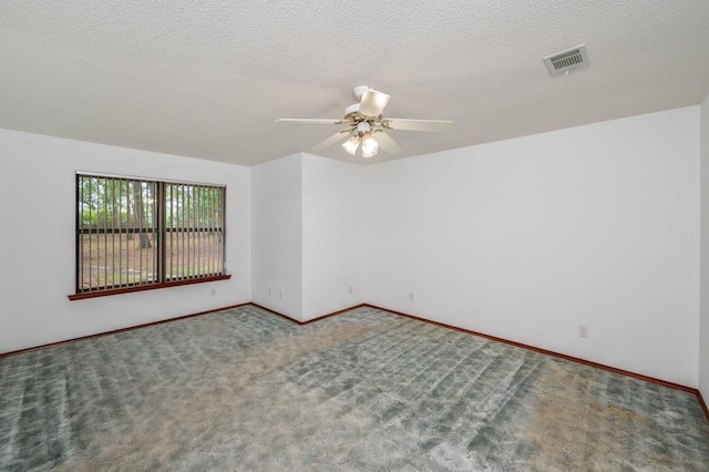 1131 Stanley Ln, Baker, FL 32531 - carpeted spare room with a ceiling fan, baseboards, and a textured ceiling
