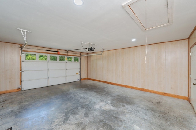 1131 Stanley Ln, Baker, FL 32531 - garage with a garage door opener, wood walls, and recessed lighting