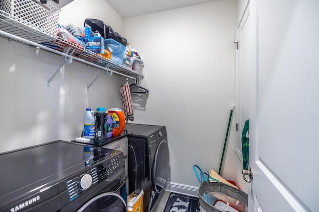 235 Coastal Breeze Dr, Freeport, FL 32439 - washroom featuring washer and clothes dryer and baseboards