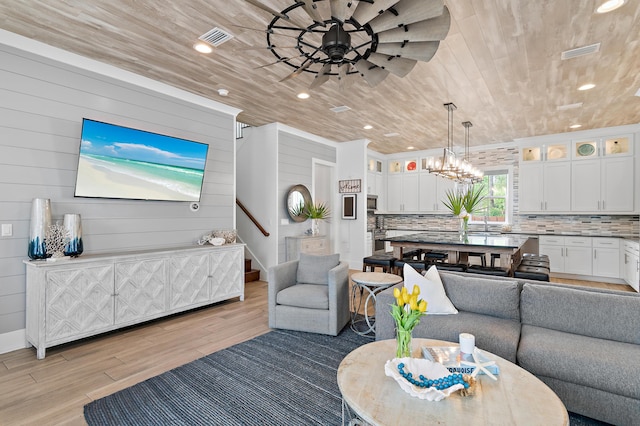 11 Wadleigh Way, Miramar Beach, FL 32550 - living room featuring wooden ceiling, light wood finished floors, ceiling fan, recessed lighting, and wood walls