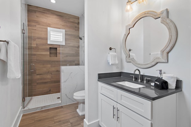 11 Wadleigh Way, Miramar Beach, FL 32550 - full bath with toilet, vanity, a stall shower, recessed lighting, and wood finished floors