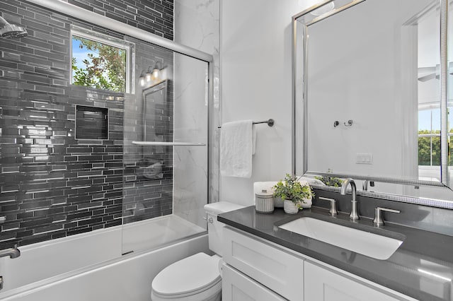 11 Wadleigh Way, Miramar Beach, FL 32550 - bathroom with vanity, bath / shower combo with glass door, and toilet