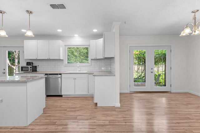 709 Russell Blvd, Fort Walton Beach, FL 32547 - kitchen with stainless steel appliances, a sink, french doors, healthy amount of natural light, and ornamental molding