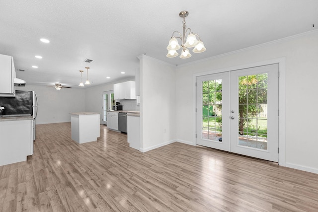 709 Russell Blvd, Fort Walton Beach, FL 32547 - kitchen featuring a chandelier, dishwasher, a kitchen island, french doors, and white cabinetry