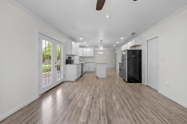 709 Russell Blvd, Fort Walton Beach, FL 32547 - unfurnished living room featuring ornamental molding, a sink, ceiling fan, light wood finished floors, and baseboards