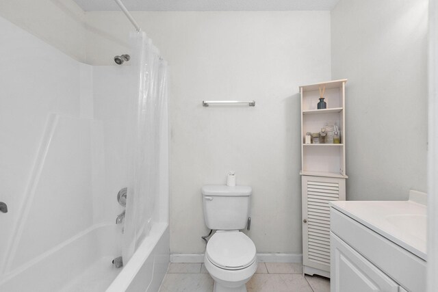 709 Russell Blvd, Fort Walton Beach, FL 32547 - bathroom with toilet, vanity, shower / tub combo with curtain, and baseboards