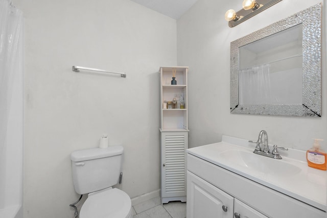 709 Russell Blvd, Fort Walton Beach, FL 32547 - full bathroom featuring vanity, toilet, baseboards, marble look tile flooring, and a shower with shower curtain