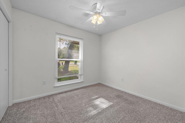 709 Russell Blvd, Fort Walton Beach, FL 32547 - unfurnished room featuring carpet, ceiling fan, baseboards, and a textured ceiling
