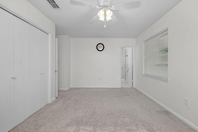 709 Russell Blvd, Fort Walton Beach, FL 32547 - unfurnished bedroom featuring carpet flooring, a closet, baseboards, ceiling fan, and ensuite bathroom