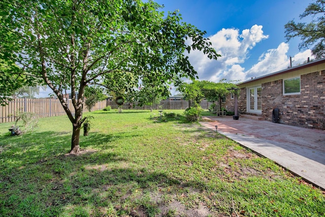 709 Russell Blvd, Fort Walton Beach, FL 32547 - view of yard featuring french doors and a patio area