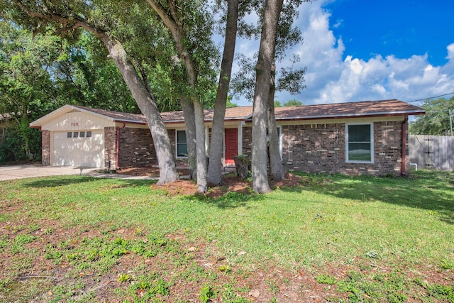 709 Russell Blvd, Fort Walton Beach, FL 32547 - single story home with brick siding, a garage, and concrete driveway