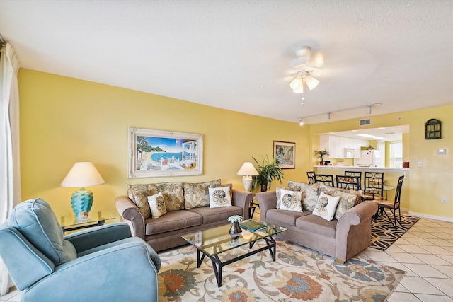 895 Santa Rosa Blvd Unit 707, Fort Walton Beach, FL 32548 - tiled living room featuring a ceiling fan, rail lighting, and baseboards
