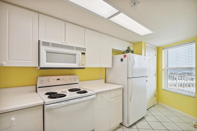 895 Santa Rosa Blvd Unit 707, Fort Walton Beach, FL 32548 - kitchen with white appliances, white cabinets, light countertops, and baseboards