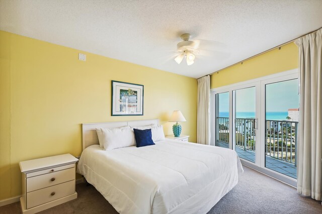 895 Santa Rosa Blvd Unit 707, Fort Walton Beach, FL 32548 - bedroom featuring dark carpet, access to exterior, a water view, and a ceiling fan