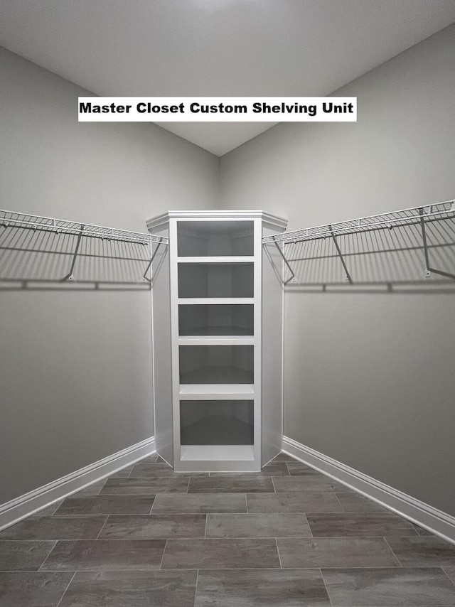 2675 Brodie Ln, Crestview, FL 32536 - walk in closet featuring wood finish floors