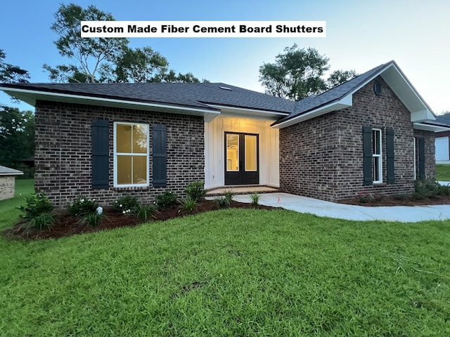 2675 Brodie Ln, Crestview, FL 32536 - single story home with brick siding, a front yard, and french doors