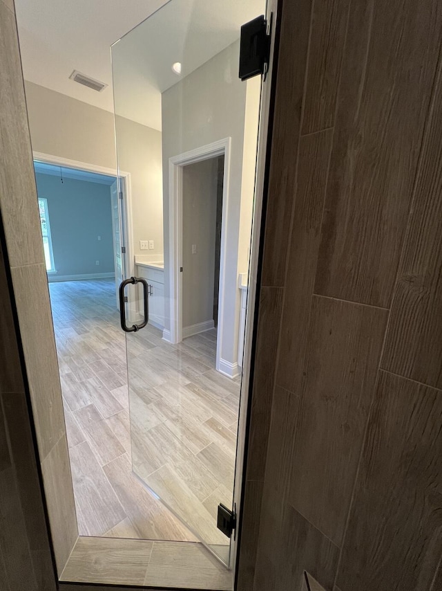 2675 Brodie Ln, Crestview, FL 32536 - hall featuring baseboards and wood tiled floors