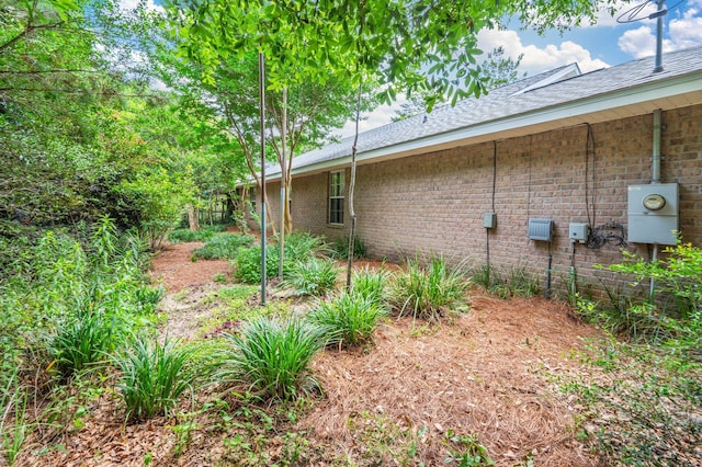5420 Flag Tail Ln, Crestview, FL 32539 - view of property exterior with brick siding and roof with shingles