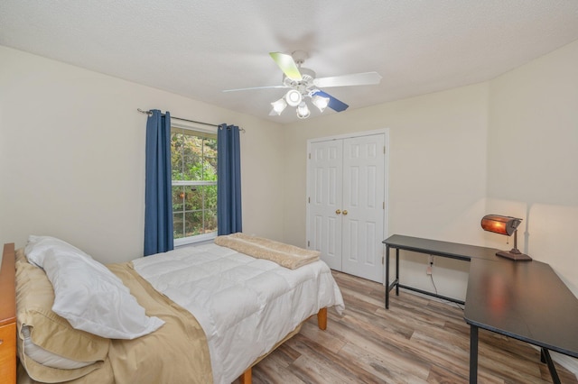 5420 Flag Tail Ln, Crestview, FL 32539 - bedroom with wood finished floors, a closet, and a ceiling fan