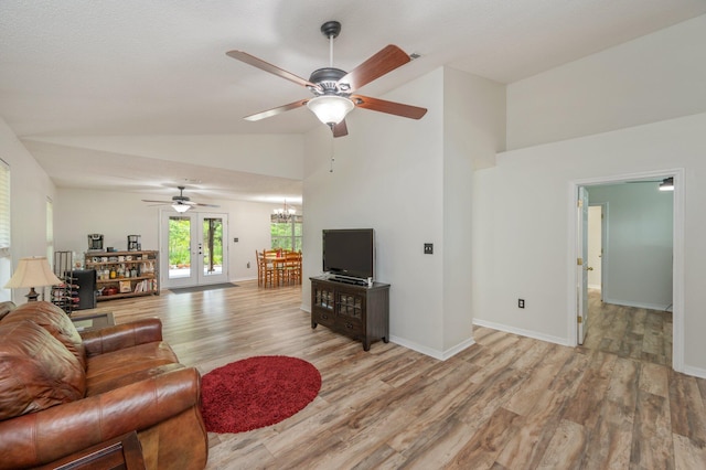 5420 Flag Tail Ln, Crestview, FL 32539 - living room with ceiling fan, light wood-style flooring, a chandelier, baseboards, and high vaulted ceiling