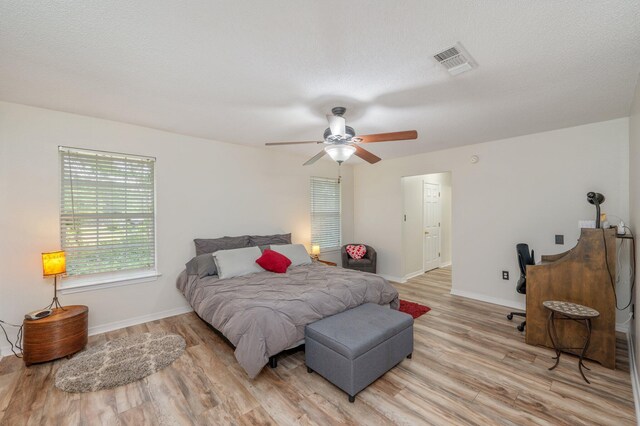 5420 Flag Tail Ln, Crestview, FL 32539 - bedroom featuring light wood-type flooring, baseboards, and a ceiling fan