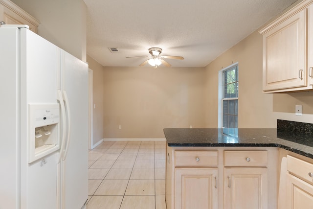 209 Warrior St, Crestview, FL 32536 - kitchen with white refrigerator with ice dispenser, a peninsula, ceiling fan, a textured ceiling, and light tile patterned floors